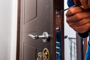 Locksmith Enhancing Home Security in Arlington - My Local Locksmith Professional locksmith upgrading a home's front door lock for added security