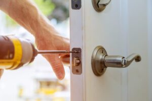 Common Lock Problems Fixed by Residential Locksmith - My Local Locksmith Residential locksmith repairing a home door lock